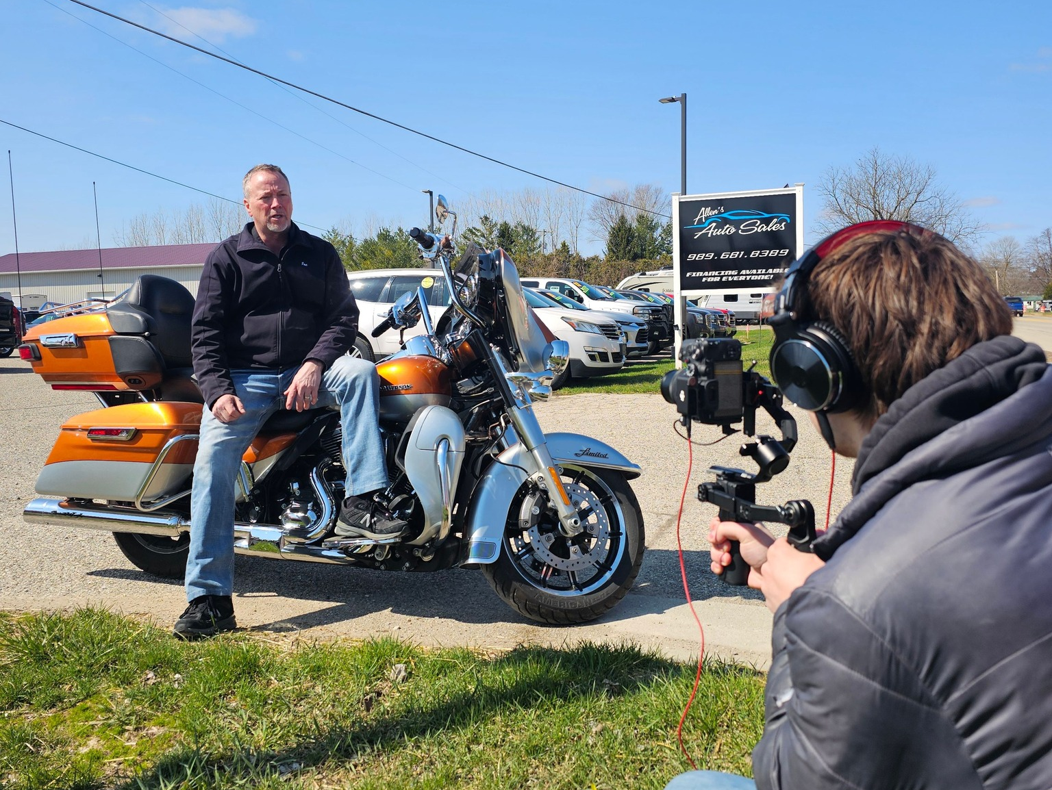 Michigan videographer Zach on-site filming content with Joe Allen from Allen's Auto Sales